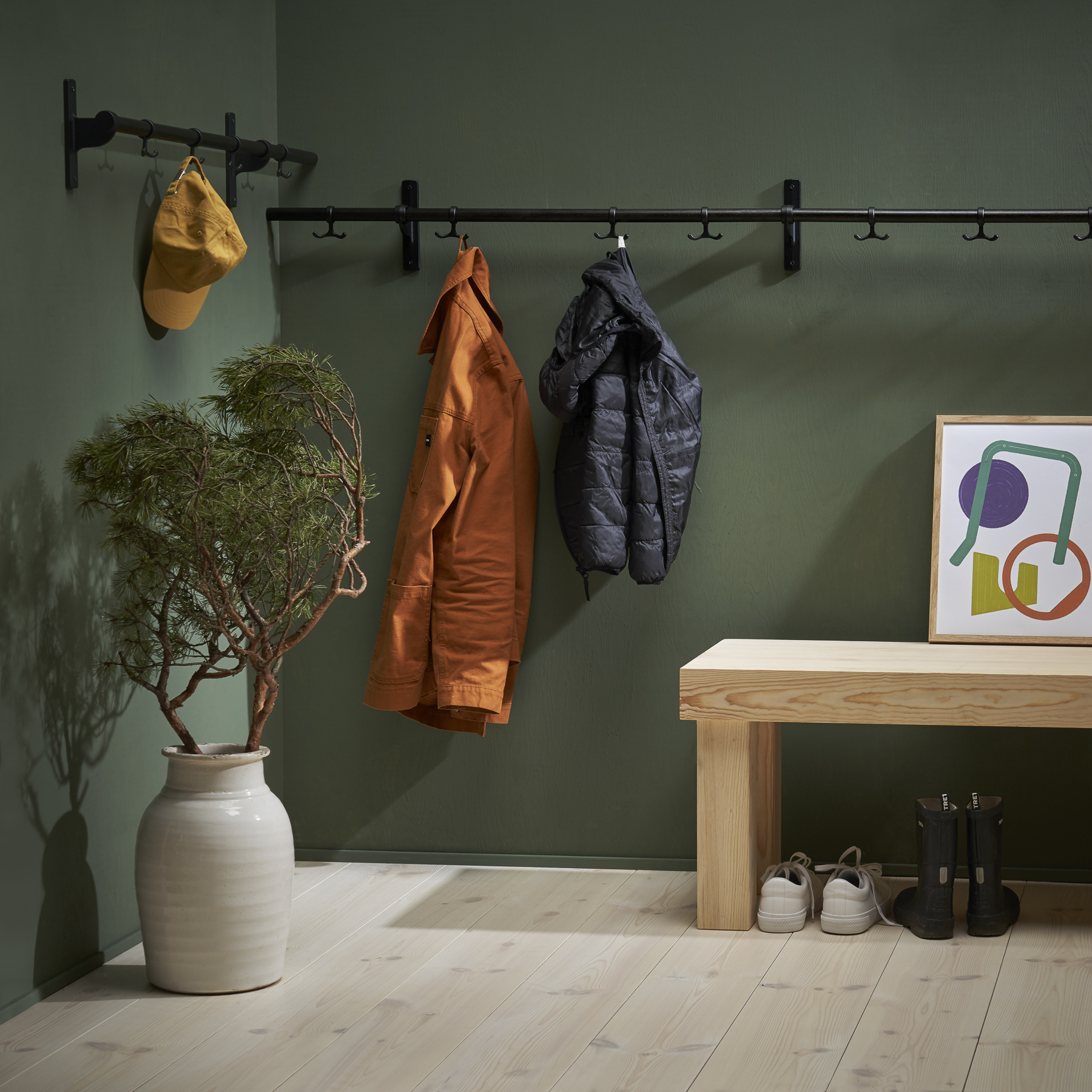 Nostalgi hook strip in black and customized length gives function in the hallway